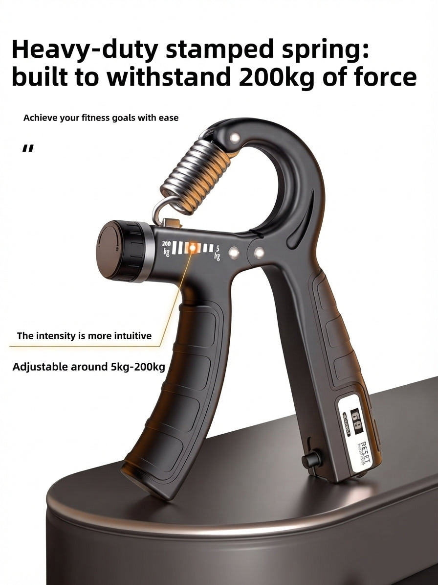 Black grip strength trainer on a metallic platform with a white background